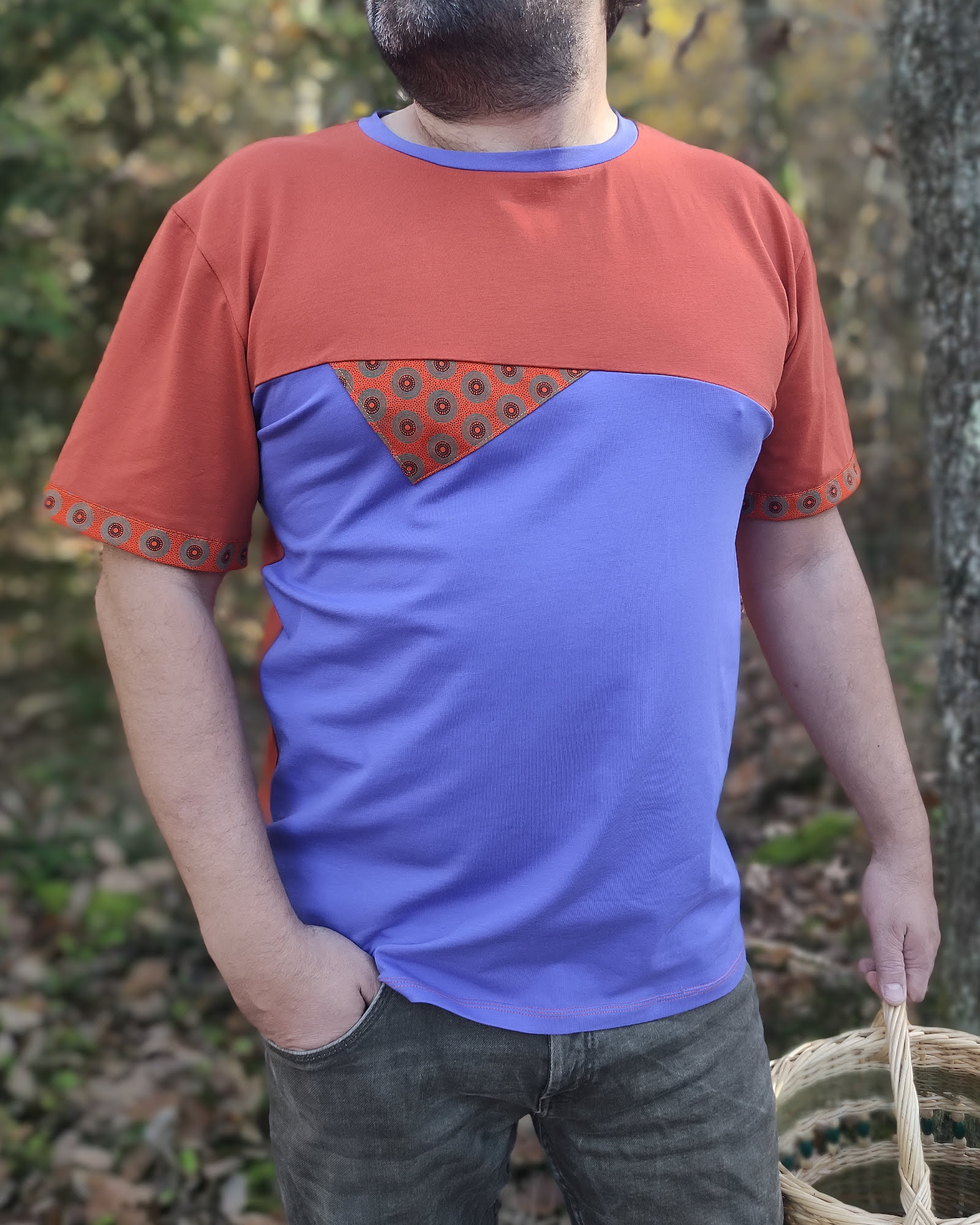 man wearing an orange and purple tshirt in organic cotton